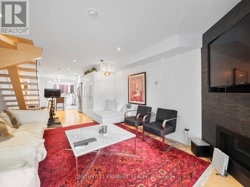 13A - 570 Wellington Street W, Toronto, ON - Indoor Photo Showing Living Room With Fireplace