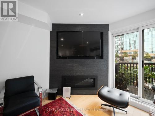 13A - 570 Wellington Street W, Toronto, ON - Indoor Photo Showing Living Room With Fireplace