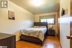 Bedroom featuring light hardwood / wood-style floors - 