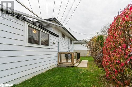 View of side of property with a deck and a yard - 262 Barrett Boulevard, Napanee, ON - Outdoor With Exterior