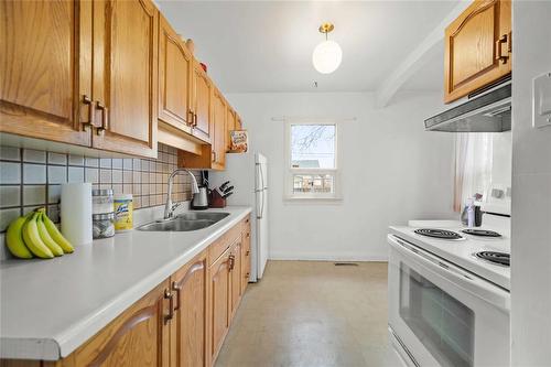 757 Inkster Boulevard, Winnipeg, MB - Indoor Photo Showing Kitchen With Double Sink