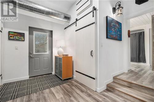 Back door to courtyard. Barn door opens to the laundry room - 123 Beckwith Street N, Smiths Falls, ON - Indoor Photo Showing Other Room