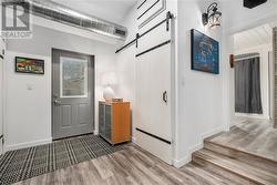 Back door to courtyard. Barn door opens to the laundry room - 