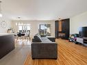 Overall view - 303-760 Rue Montmartre, Mascouche, QC  - Indoor Photo Showing Living Room With Fireplace 