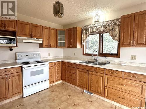 22 Poundmaker Trail, North Battleford, SK - Indoor Photo Showing Kitchen With Double Sink