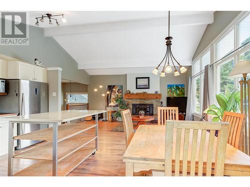 1740 Mountain Avenue, Kelowna, BC - Indoor Photo Showing Dining Room With Fireplace