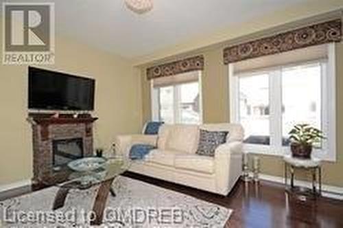 4799 Thomas Alton Boulevard, Burlington, ON - Indoor Photo Showing Living Room With Fireplace