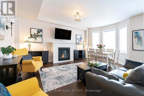 135 Ritchie Crescent, Springwater, ON - Indoor Photo Showing Living Room With Fireplace