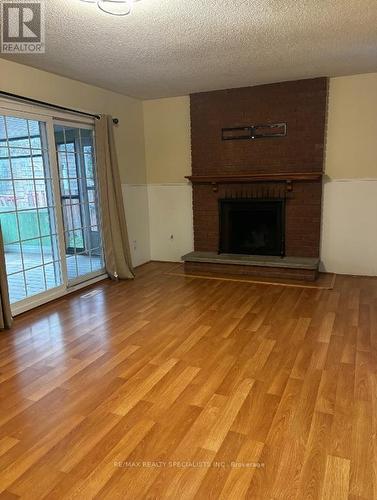 Lower - 20 Roseville Drive, Brampton, ON - Indoor Photo Showing Living Room With Fireplace