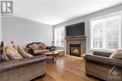 634 Silver Spruce Way, Ottawa, ON - Indoor Photo Showing Living Room With Fireplace