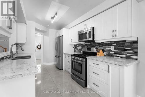 28 Mcgahey Street, New Tecumseth, ON - Indoor Photo Showing Kitchen With Double Sink With Upgraded Kitchen