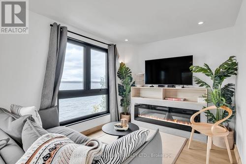 12 - 1026 Merrill Road, Alnwick/Haldimand, ON - Indoor Photo Showing Living Room With Fireplace