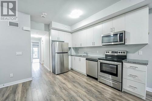 713 - 2635 William Jackson Drive, Pickering, ON - Indoor Photo Showing Kitchen With Stainless Steel Kitchen With Double Sink