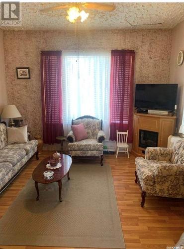 830 Main Street, Holdfast, SK - Indoor Photo Showing Living Room With Fireplace