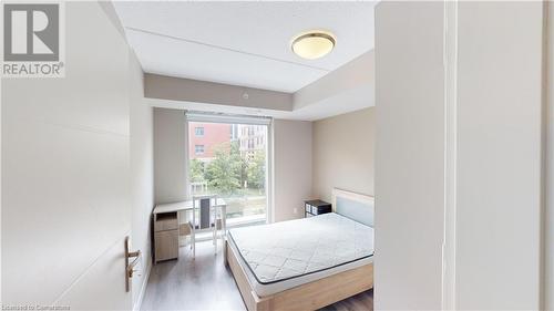 Bedroom featuring hardwood / wood-style floors - 308 Lester Street Unit# 215, Waterloo, ON - Indoor Photo Showing Bedroom