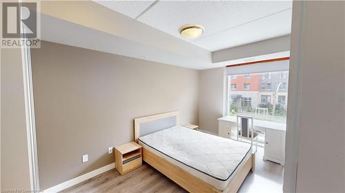 Bedroom with light hardwood / wood-style floors - 308 Lester Street Unit# 215, Waterloo, ON - Indoor Photo Showing Bedroom