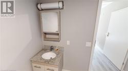 Bathroom featuring hardwood / wood-style flooring and vanity - 