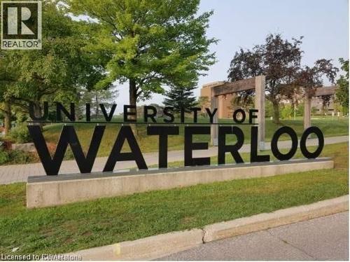 Community / neighborhood sign featuring a lawn - 308 Lester Street Unit# 215, Waterloo, ON - Outdoor