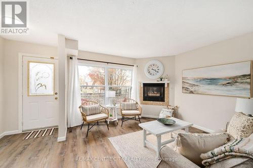 20 - 215 Commissioners Road W, London, ON - Indoor Photo Showing Living Room With Fireplace