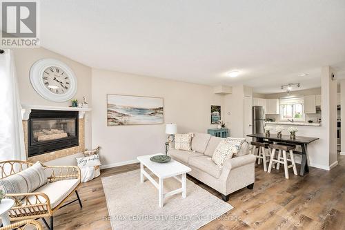 20 - 215 Commissioners Road W, London, ON - Indoor Photo Showing Living Room With Fireplace