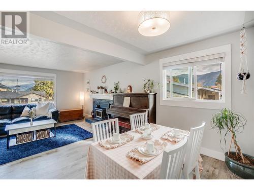 1696 Ridgewood Drive Drive, Castlegar, BC - Indoor Photo Showing Dining Room With Fireplace