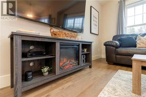 33 Robert Ross Boulevard, Hampton, NB - Indoor Photo Showing Living Room With Fireplace