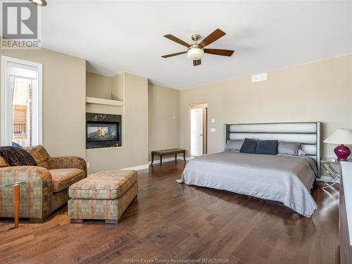 581 Ross Beach Road, Lakeshore, ON - Indoor Photo Showing Bedroom With Fireplace