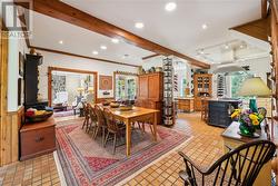 Spacious dining area off the kitchen - view of living room, sunroom to the left - 