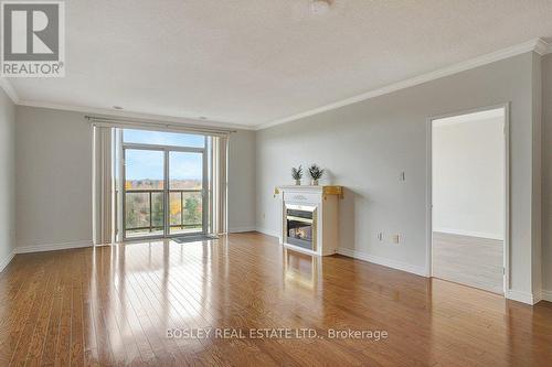 805 - 255 Keats Way S, Waterloo, ON - Indoor Photo Showing Living Room With Fireplace