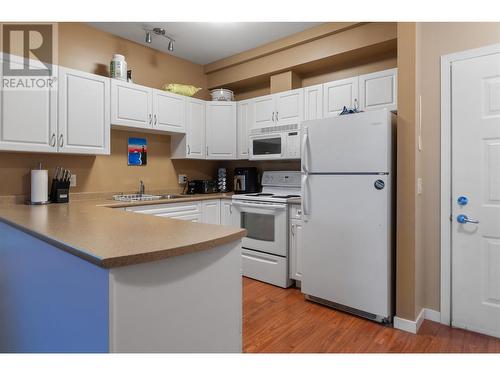 778 Rutland Road Unit# 406, Kelowna, BC - Indoor Photo Showing Kitchen With Double Sink