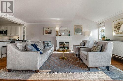 523 - 40 Sylvan Valleyway, Toronto, ON - Indoor Photo Showing Living Room With Fireplace