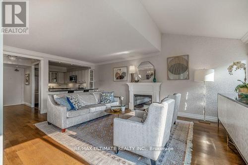 523 - 40 Sylvan Valleyway, Toronto, ON - Indoor Photo Showing Living Room With Fireplace