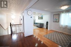 Corridor featuring hardwood / wood-style flooring - 