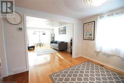 Hallway with hardwood / wood-style flooring - 