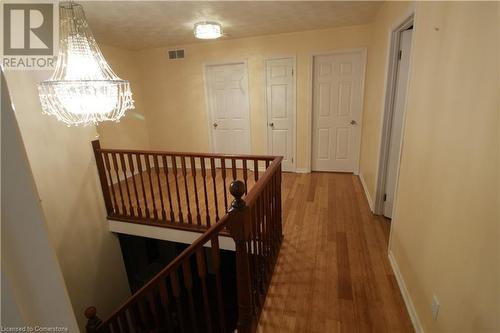 Corridor with hardwood / wood-style floors and a textured ceiling - 30 Kristi Place, Kitchener, ON - Indoor Photo Showing Other Room