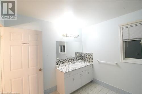 Bathroom with backsplash, vanity, and tile patterned flooring - 30 Kristi Place, Kitchener, ON - Indoor