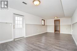 Unfurnished room with hardwood / wood-style floors - 