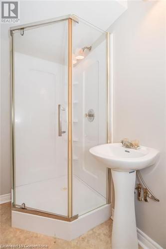 Bathroom featuring sink and a shower with shower door - 30 Kristi Place, Kitchener, ON - Indoor Photo Showing Bathroom