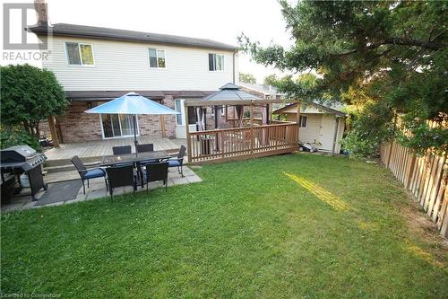 Back of property with a patio area, a yard, a shed, and a deck - 30 Kristi Place, Kitchener, ON - Outdoor With Deck Patio Veranda With Exterior