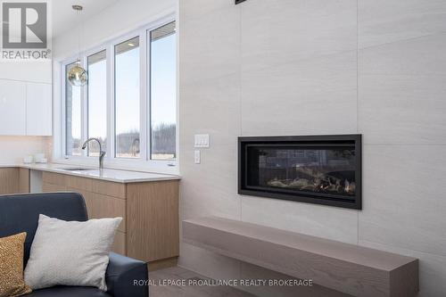 158 Summerside Drive, South Frontenac, ON - Indoor Photo Showing Living Room With Fireplace