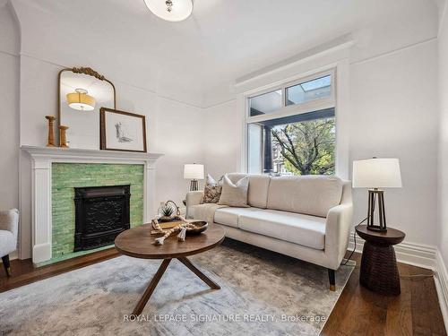 23 Geoffrey St, Toronto, ON - Indoor Photo Showing Living Room With Fireplace