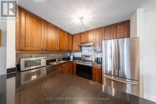 Ph 412 - 4620 Highway 7, Vaughan, ON - Indoor Photo Showing Kitchen With Stainless Steel Kitchen