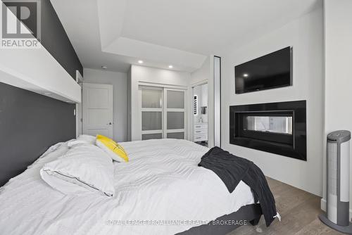 181 Morgan Drive, South Frontenac (Frontenac South), ON - Indoor Photo Showing Bedroom With Fireplace