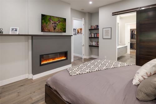 3630 Boxwood Road, Kelowna, BC - Indoor Photo Showing Bedroom With Fireplace