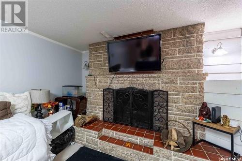 1314 Henleaze Avenue, Moose Jaw, SK - Indoor Photo Showing Bedroom With Fireplace