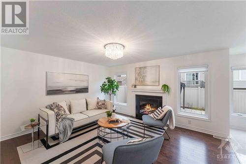 580 Sunlit Circle, Ottawa, ON - Indoor Photo Showing Living Room With Fireplace