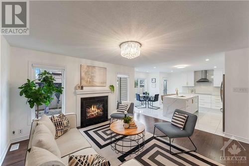 580 Sunlit Circle, Ottawa, ON - Indoor Photo Showing Living Room With Fireplace