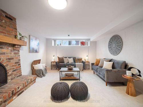 23 Wichey Rd, Toronto, ON - Indoor Photo Showing Living Room With Fireplace