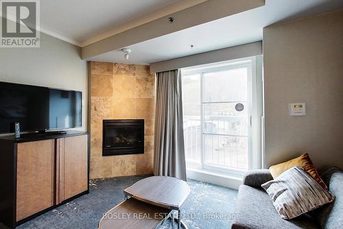 303 - 220 Gord Canning Drive, Blue Mountains, ON - Indoor With Fireplace