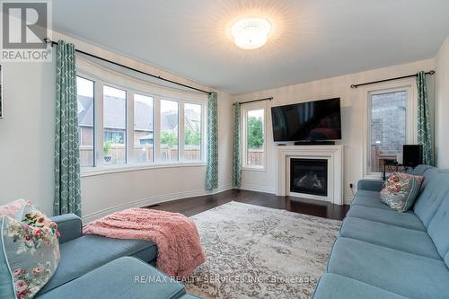 28 Stonegate Avenue, Mono, ON - Indoor Photo Showing Living Room With Fireplace